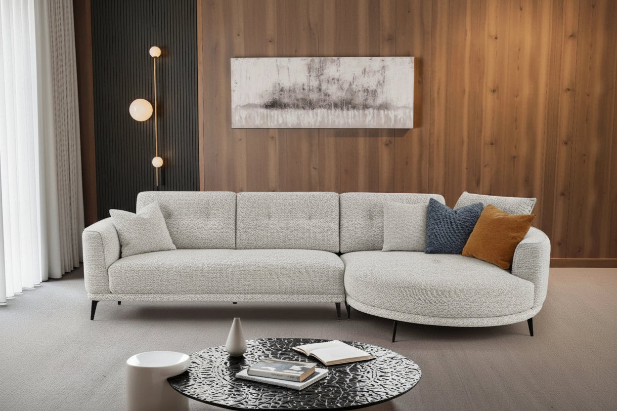 Rene modern gray sectional sofa, round coffee table, and decorative elements.