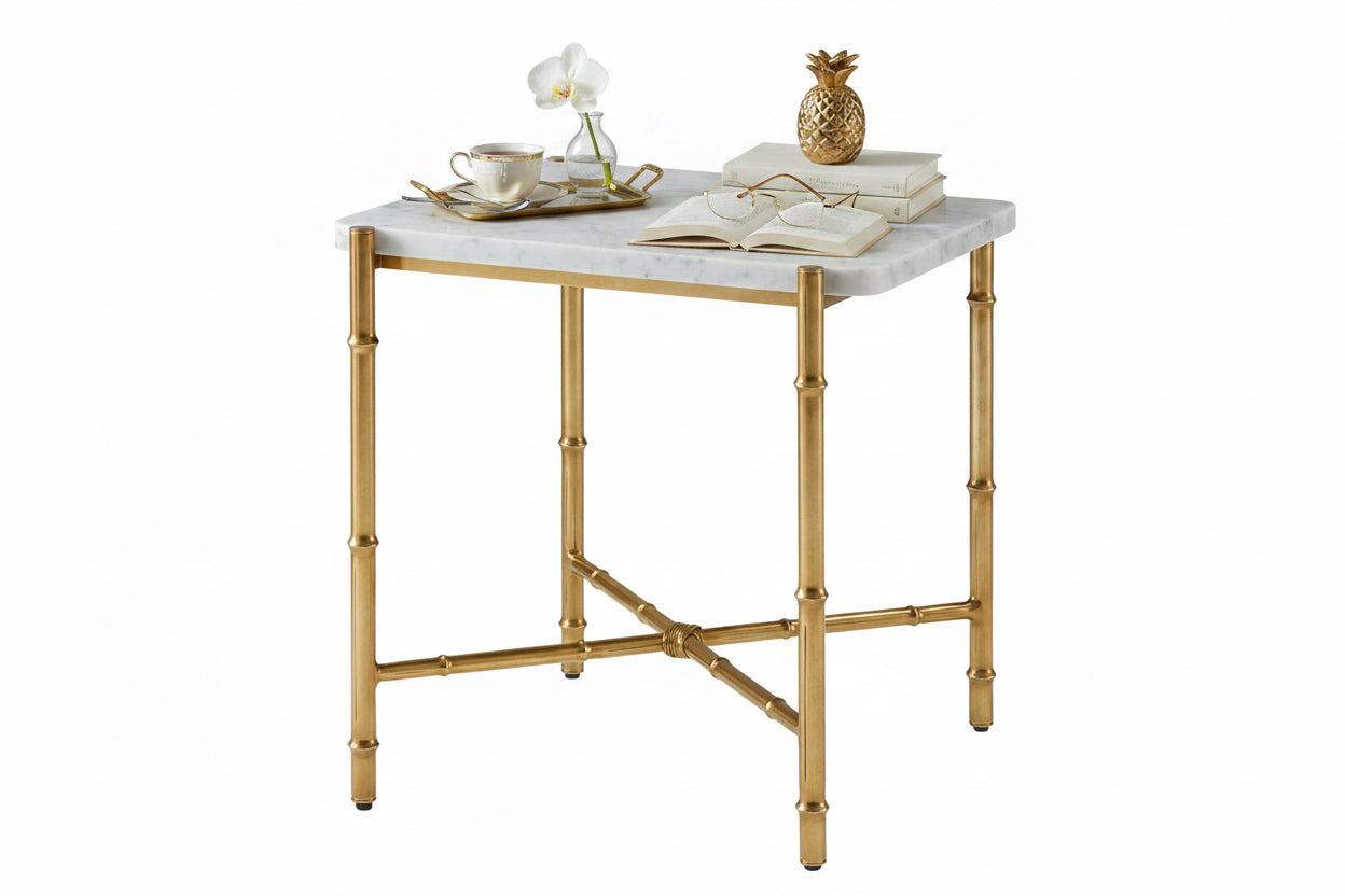 Small table with marble top and gold metal frame on a white background