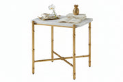 Small table with marble top and gold metal frame on a white background