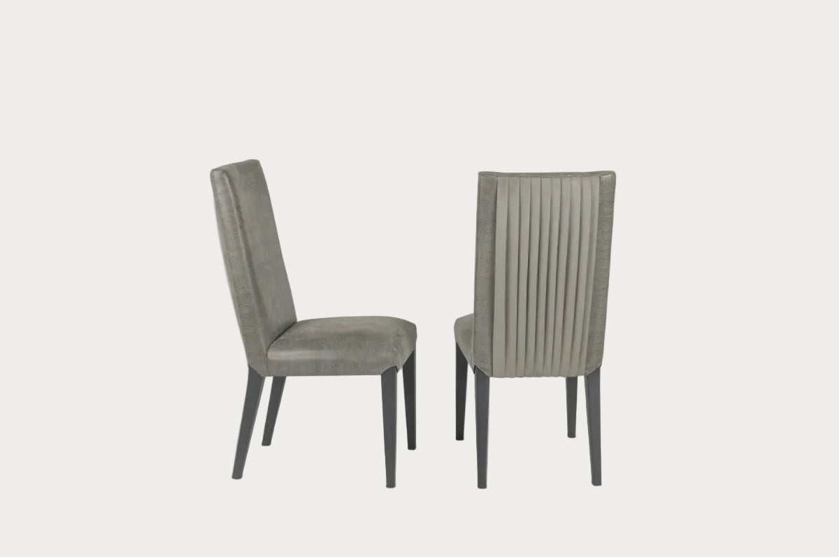 Two gray upholstered chairs on a white background