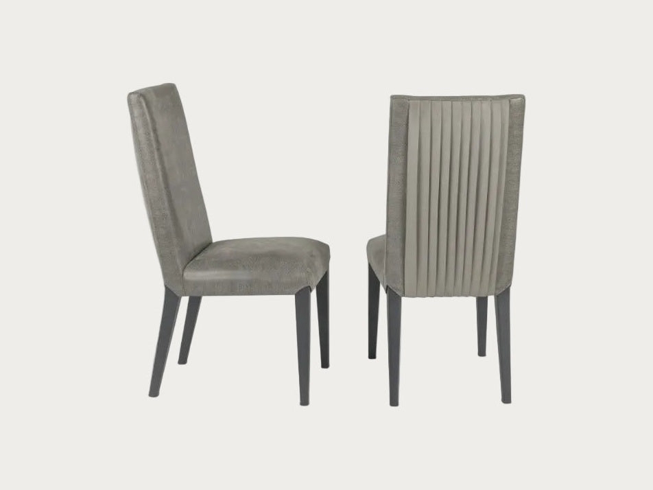Two gray upholstered chairs on a white background